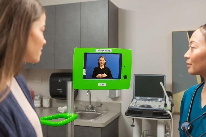 Interpreter assisting a medical consultation via video